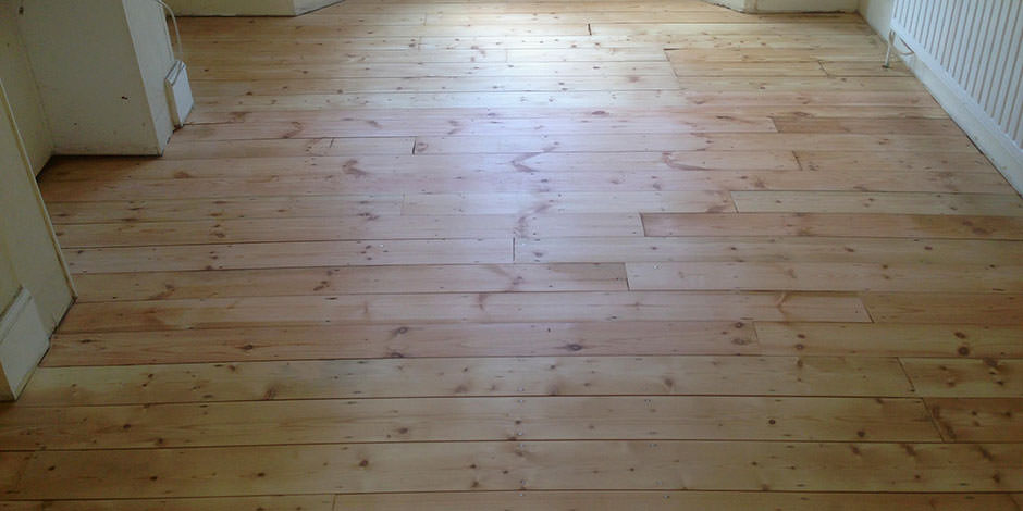 After-LOUNGE REPAIRED PINE BOARDS IN ISLINGTON