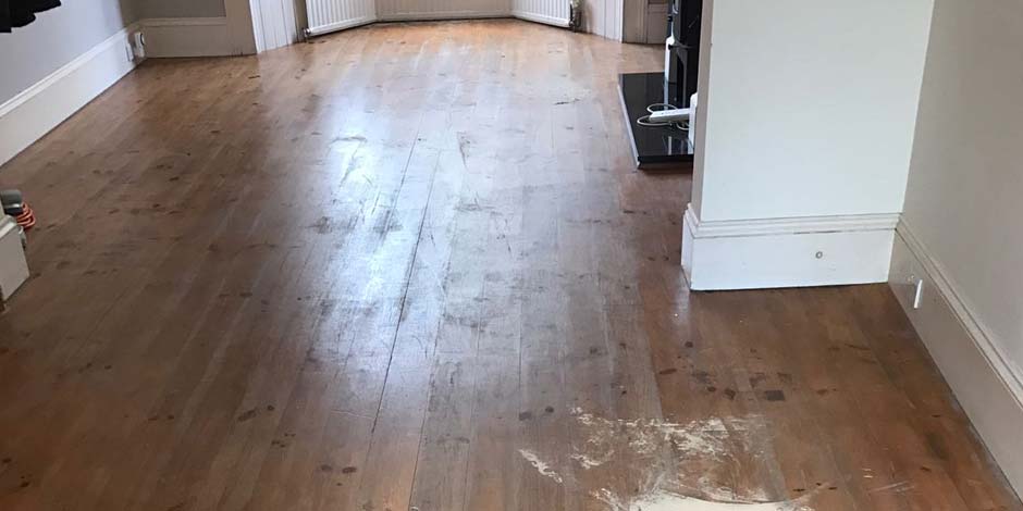 Before-LOUNGE AREA WITH REPAIR AND NATURAL FINISH